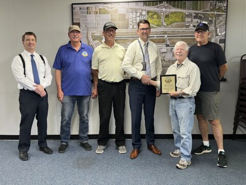 Wings Over Camarillo presents a plaque to our humble staff