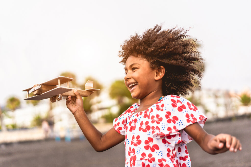 Girl with model airplane